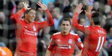 Liverpool's Uruguayan  forward Luis Suárez (L) celebrates after scoring the opening goal with Liverpool's Argentine midfielder Maxi Rodríguez (R) during the English FA Cup quarter final football match between Liverpool and Stoke City at Anfield in Liverpool, north-west England on March 18 2012\u002E AFP PHOTO/ANDREW YATES\u002E RESTRICTED TO EDITORIAL USE\u002E No use with unauthorized audio, video, data, fixture lists, club/league logos or “live” services\u002E Online in-match use limited to 45 images, no video emulation\u002E No use in betting, games or single club/league/player publications\u002E\r\n inglaterra luis suarez maximiliano rodriguez campeonato torneo liga inglesa ingles futbol futbolistas partido liverpool Stoke City