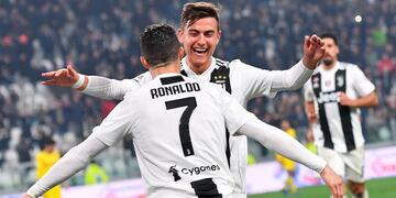 Juventus' Cristiano Ronaldo celebrates with his teammate Paulo Dybala after scoring during the Serie A soccer match between Juventus and Frosinone at the Allianz Stadium in Turin, Italy, Friday, Feb\u002E 15, 2019\u002E (Alessandro Di Marco/ANSA via AP) italia campeonato torneo liga italiano italiana futbol futbolistas partido Juventus FC Frosinone
