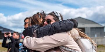 Relatives of people aboard the Chilean Air Force C-130 Hercules cargo plane that went missing in the sea between the southern tip of South America and Antarctica, embrace at Chabunco army base in Punta Arenas, Chile, on December 11, 2019\u002E - Rescue planes and ships on Tuesday searched the open sea between the southern tip of South America and Antarctica for a Chilean Air Force plane that went missing with 38 people aboard\u002E (Photo by Joel ESTAY / AFP)