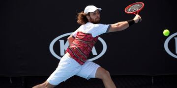 Marco Trungelliti of Argentina makes a backhand return to Tennys Sandgren of the U\u002ES\u002E during their first round singles match at the Australian Open tennis championship in Melbourne, Australia, Tuesday, Jan\u002E 21, 2020\u002E (AP Photo/Andy Brownbill)
