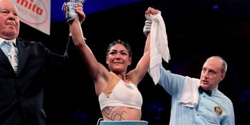 Brenda Karen Carabajal wears the belt after defeating Elena Gradinar during a women's featherweight IBF world championship boxing bout Saturday, April 13, 2019, in Atlantic City, N\u002EJ\u002E (AP Photo/Julio Cortez)