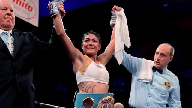 Brenda Karen Carabajal wears the belt after defeating Elena Gradinar during a women's featherweight IBF world championship boxing bout Saturday, April 13, 2019, in Atlantic City, N\u002EJ\u002E (AP Photo/Julio Cortez)