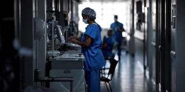 (FILES) In this file photo taken on June 1, 2020 a health professional works at the Intensive Care Unit (ICU) ward where patients infected with the COVID-19 novel coronavirus are being treated, at the Santa Casa hospital in Belo Horizonte, state of Minas Gerais, Brazil\u002E - Massive amounts of government emergency funds to fight the pandemic say are being stolen in the world's second-hardest-hit country, experts saym as the rush to respond to COVID-19 is sideswiped by an older, endemic disease: corruption\u002E Brazil has a long history of graft scandals\u002E But even by Brazilian standards, the scope of the accusations is outrageous\u002E Even football superstar Neymar got dragged in\u002E His name and personal data were used to register for the 600-real monthly stimulus payments the federal government is paying poor Brazilians hit hard by lockdown measures\u002E (Photo by Douglas MAGNO / AFP)