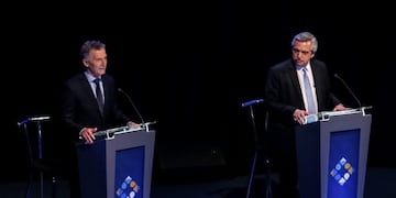 FILE PHOTO: Argentina's President Mauricio Macri and presidential candidate Alberto Fernandez participate in the presidential debate ahead of the October 27 presidential election, at the University of Buenos Aires' Law School, in Buenos Aires, Argentina, October 20, 2019\u002E REUTERS/Agustin Marcarian/File Photo/File Photo