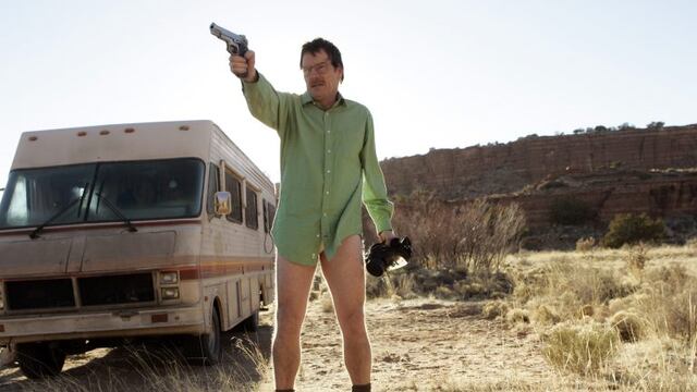 This image released by AMC shows Walter White, played by Bryan Cranston, next to the Winnebago he uses as a mobile meth lab in the pilot episode of \
