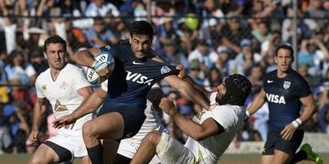 Argentina's Los Pumas centre Jeronimo De La Fuente (2-L) is tackled by Georgia's flanker Viktor Kolelishvili (2-R) during their Rugby Union test match at 23 de Agosto stadium in San Salvador de Jujuy, Jujuy, Argentina on June 24, 2017\u002E / AFP PHOTO / JUAN MABROMATA