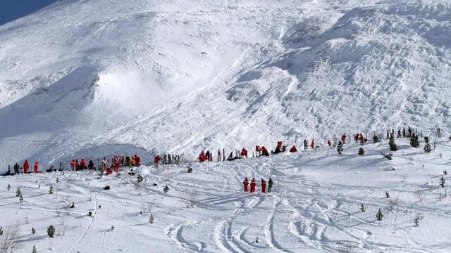CORRECTION - (FILES) This file handout photo taken and realeased on February 13, 2017 and made available by Radio Val d'Isere in Tignes, in the French Alps shows an avalanche site in an off-piste area after an avalanche engulfed nine people, killing at le