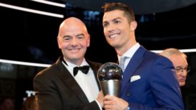 Portugal's Cristiano Ronaldo, right, poses with FIFA President Gianni Infantino after winning The Best FIFA Men's Player award during the The Best FIFA Football Awards 2016 ceremony held at the Swiss TV studio in Zurich, Switzerland, Monday, Jan. 9, 2017.