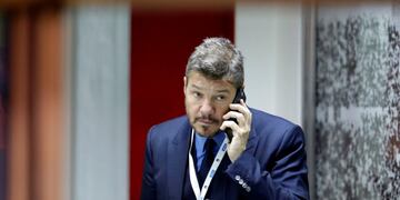 TV host, media producer and businessman Marcelo Tinelli speaks on the phone before a 2018 Russia World Cup qualifying soccer match between Argentina and Chile at the Monumental stadium in Buenos Aires, Argentina, Thursday March 23, 2017.(AP Photo/Victor R