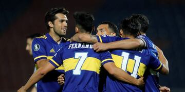 Argentina's Boca Juniors midfielder Eduardo Salvio celebrates with teammates after scoring against Paraguay's Libertad during their closed-door Copa Libertadores group phase football match at the La Nueva Olla stadium in Asuncion, on September 17, 2020, amid the COVID-19 novel coronavirus pandemic\u002E (Photo by Jorge SAENZ / various sources / AFP)