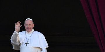 Pope Francis waves from the balcony of St Peter's basilica during the traditional \