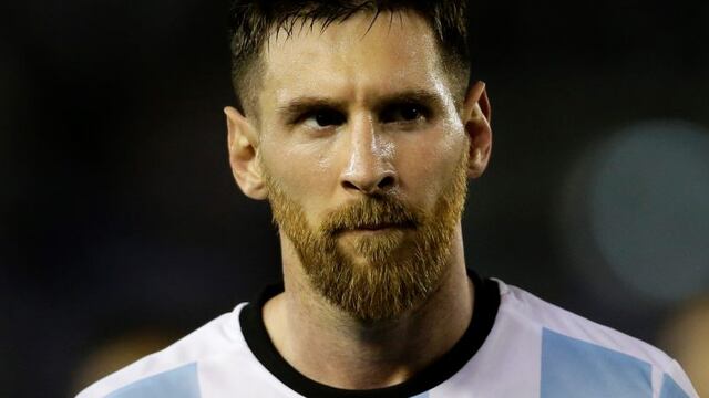 In this March 23, 2017 Argentina's Lionel Messi leaves the pitch at the end of a World Cup qualifying match against Chile in Buenos Aires, Argentina. Messi has been banned from Argentina's next four World Cup qualifiers, starting with the Tuesday, March 28, 2017 game in Bolivia, for