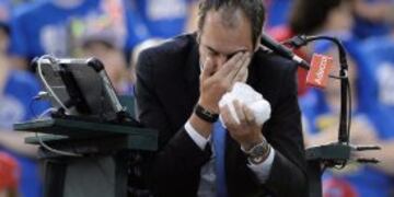 Umpire Arnaud Gabas, of France, holds his face after being hit by a ball during first-round Davis Cup tennis match action between Canada's Denis Shapovalov and Britain's Kyle Edmund, Sunday, Feb. 5, 2017, in Ottawa, Ontario. (Justin Tang/The Canadian Pres