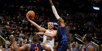 Mar 29, 2018; San Antonio, TX, USA; San Antonio Spurs shooting guard Manu Ginobili (20) passes the ball against Oklahoma City Thunder small forward Paul George (right) during the first half at AT&T Center\u002E Mandatory Credit: Soobum Im-USA TODAY Sports
