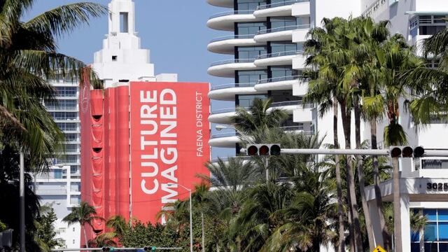 In this Tuesday, Feb. 14, 2017 photo, a mural identifies buildings in the Faena District on Collins Ave. in the Mid-Beach neighborhood of Miami Beach, Fla. Faena House, center, and the Faena Hotel, right, are part of a cluster of buildings developed by Argentine hotel magnate Alan Faena, where decaying structures and empty parking lots are giving way to opulent hotels, condos, and a performing arts center. (AP Photo/Lynne Sladky) miami eeuu  recorrida por el nuevo Faena Hotel hotel frente al mar en el distrito de faena conjunto de edificios desarrollados por el magnate argentino