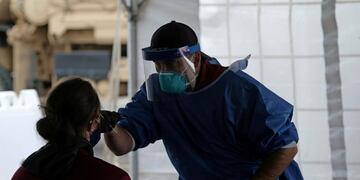 A woman receives the coronavirus disease (COVID-19) test, distributed by the Wisconsin National Guard at the United Migrant Opportunity Services center, as cases spread in the Midwest, in Milwaukee, Wisconsin, U\u002ES\u002E, October 2, 2020\u002E REUTERS/Alex Wroblewski