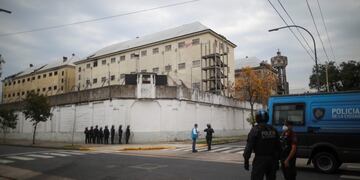 Police take position outside the Villa Devoto prison where inmates riot to protest authorities are not doing enough to prevent the spread of coronavirus inside the jail in Buenos Aires, Argentina, Friday, April 24, 2020\u002E (AP Photo/Natacha Pisarenko)