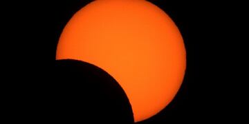 Solar eclipse as seen from Congreso neighborhood in the city of Buenos Aires, Argentina, on July 2, 2019\u002E - Tens of thousands of tourists braced Tuesday for a rare total solar eclipse that was expected to turn day into night along a large swath of Latin America's southern cone\u002E (Photo by ALEJANDRO PAGNI / AFP)