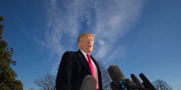 President Donald Trump speaks on the South Lawn of the White House as he walks from Marine One, Sunday, Jan\u002E 6, 2019, in Washington\u002E Trump returned from a trip to Camp David\u002E (AP Photo/Alex Brandon)
