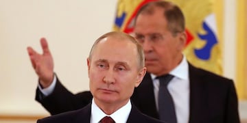 Russian President Vladimir Putin, foreground, and Russian Foreign Minister Sergey Lavrov prepare to toast at a ceremony of receiving credentials from foreign ambassadors in the Kremlin in Moscow, Russia, Wednesday, April 11, 2018\u002E (Sergei Ilnitsky/Pool Photo via AP)