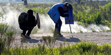 Squatters clash with police evicting them from a field where they lived in Guernica, Buenos Aires province, Argentina, Thursday, Oct\u002E 29, 2020\u002E A court ordered the eviction of families who are squatting here since July, but the families say they have nowhere to go amid the COVID-19 pandemic\u002E (AP Photo/Natacha Pisarenko)