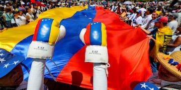 Anti-government protesters start to gather for a rally to demand the resignation of Venezuelan President Nicolas Maduro in Caracas, Venezuela, Monday, March 4, 2019\u002E The United States and about 50 other countries recognize opposition Congress President Juan Guaido as the rightful president of Venezuela, while Maduro says he is the target of a U\u002ES\u002E-backed coup plot\u002E (AP Photo/Eduardo Verdugo)