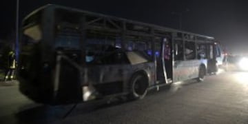 Afghan security forces remove a damaged bus forces turck remove a damaged bus after twin blasts near the Afghan parliament in Kabul on January 10, 2017.nnTwin Taliban blasts struck near the Afghan parliament in Kabul January 10, killing at least 30 peopl