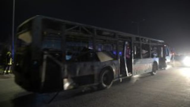 Afghan security forces remove a damaged bus forces turck remove a damaged bus after twin blasts near the Afghan parliament in Kabul on January 10, 2017.nnTwin Taliban blasts struck near the Afghan parliament in Kabul January 10, killing at least 30 peopl