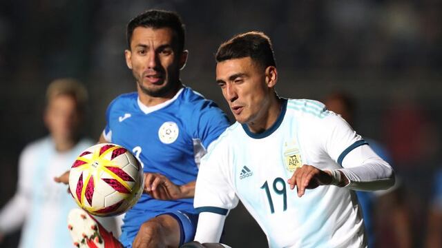 Argentina's Lionel Messi (L) celebrates with teammate Matias Suarez after scoring against Nicaragua during their international friendly football match at the San Juan del Bicentenario stadium in San Juan, Argentina, on June 7, 2019\u002E (Photo by Andres LARROVERE / AFP)