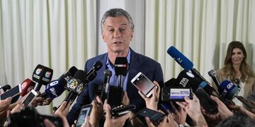 Argentina's president and presidential candidate for the Juntos por el Cambio party Mauricio Macri speaks to the press after voting at a polling station in Buenos Aires during Argentina's general election on October 27, 2019\u002E - Polls opened early Sunday for Argentina's 34 million registered voters in an election in which the main opposition candidate Alberto Fernandez is widely tipped in opinion polls to obtain the 45 percent of votes needed to secure an outright victory in the first round\u002E (Photo by JUAN MABROMATA / AFP)