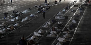 LAS VEGAS, NEVADA - MARCH 30: People sleep in social-distancing boxes at a temporary homeless shelter set up in a parking lot at Cashman Center on March 30, 2020 in Las Vegas, Nevada\u002E Catholic Charities of Southern Nevada was closed last week after a homeless man who used their services tested positive for the coronavirus, leaving about 500 people with no overnight shelter\u002E The city of Las Vegas, Clark County and local homeless providers plan to operate the shelter through April 3rd when it is anticipated that the Catholic Charities facility will be back open\u002E The city is also reserving the building spaces at Cashman Center in case of an overflow of hospital patients\u002E The World Health Organization declared the coronavirus (COVID-19) a global pandemic on March 11th\u002E Ethan Miller/Getty Images/AFP\n== FOR NEWSPAPERS, INTERNET, TELCOS & TELEVISION USE ONLY ==