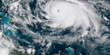 This satellite image obtained from NOAA/RAMMB, shows Tropical Storm Dorian as it approaching the Bahamas and Florida at 13:430UTC on August 31, 2019\u002E - Dorian changed course slightly on Saturday, possibly putting it on track to hit the Carolinas rather than Florida as previously forecast, after a dangerous blast through the Bahamas\u002E Meteorologists said Dorian has grown into an extremely dangerous Category 4 storm as it heads toward land\u002E (Photo by HO / NOAA/RAMMB / AFP) / RESTRICTED TO EDITORIAL USE - MANDATORY CREDIT \