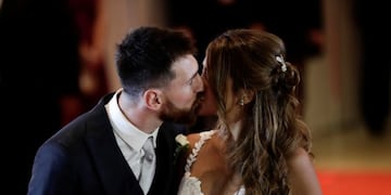 Newlyweds Lionel Messi and Antonella Roccuzzo kiss while posing for photographers on the red carpet after tying the knot in Rosario, Argentina, Friday, June 30, 2017\u002E About 250 guests, including teammates and former teammates of the Barcelona star, attended the highly anticipated ceremony\u002E (AP Photo/Victor R\u002E Caivano)