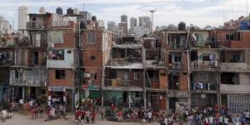 Residents are seen in the Villa 31 slum, which censuses show has grown 50 percent in the past four years to currently house some 40,000 people, near the 100-year-old railway station Retiro in the heart of Buenos Aires, February 9, 2014. A sharp currency d