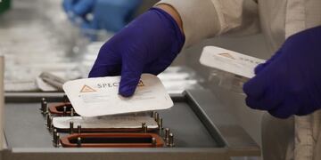 DRAPER, UT - SEPTEMBER 21: Employees at Spectrum Solutions assembles COVID-19 saliva test kits on September 21, 2020 in Draper, Utah\u002E Spectrum Solutions has partnered with many professional sport leagues and corporations to provide rapid saliva tests for the coronavirus (COVID-19)\u002E George Frey/Getty Images/AFP\n== FOR NEWSPAPERS, INTERNET, TELCOS & TELEVISION USE ONLY ==