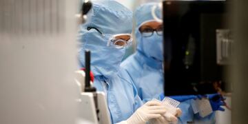 An employee of a testing company Qiagen is seen at their workplace as Economy Minister Andreas Pinkwart and Health Minister Karl-Josef Laumann of the German state Northrhine Westphalia visit Qiagen's facility, in Hilden, Germany, September 8, 2020\u002E REUTERS/Leon Kuegeler