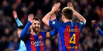 Barcelona's Croatian midfielder Ivan Rakitic (R) celebrates with Barcelona's Argentinian forward Lionel Messi after scoring a goal during the Spanish league football match FC Barcelona vs RC Celta de Vigo at the Camp Nou stadium in Barcelona on March 4, 2