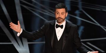 (FILES) This file photo taken on February 26, 2017 shows Host Jimmy Kimmel on stage at the 89th Oscars in Hollywood, California.nLate night funnyman Jimmy Kimmel will return to host the Oscars, the Academy said May 16, 2017, as the glitzy annual show moves on from the biggest mix-up in its history. The 49-year-old comedian will be reunited with producers Michael De Luca and Jennifer Todd for the 90th Academy Awards, which will take place on March 4, 2018.n / AFP PHOTO / Mark RALSTON