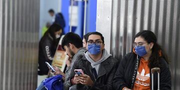 Passengers wearing protective masks are seen at the International Airport in Mexico City, Mexico, on February 28, 2020\u002E - Mexico's Health Ministry confirmed the country's first case of coronavirus on Friday, saying a young man had tested positive for it in the capital\u002E (Photo by ALFREDO ESTRELLA / AFP)