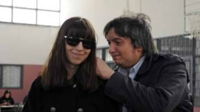 The daughter and son of Argentine President Cristina Fernandez de Kirchner, Florencia (L) and Maximo wait to cast their vote at the Escuela Nu00ba 44, in Ru00edo Gallegos, province of Santa Cruz, on October 27, 2013, during Argentina's legislative elections. Voting got under way in Argentina Sunday in midterm elections that observers said could mark the beginning of President Cristina Kirchner's political unraveling. More than 30 million voters were eligible to cast ballots to elect half the lower chamber of Congress and a third of the Senate.    AFP PHOTO / NA - OPI SANTA CRUZ-FRANCISCO MUu00d1OZ     RESTRICTED TO EDITORIAL USE  MANDATORY CREDIT