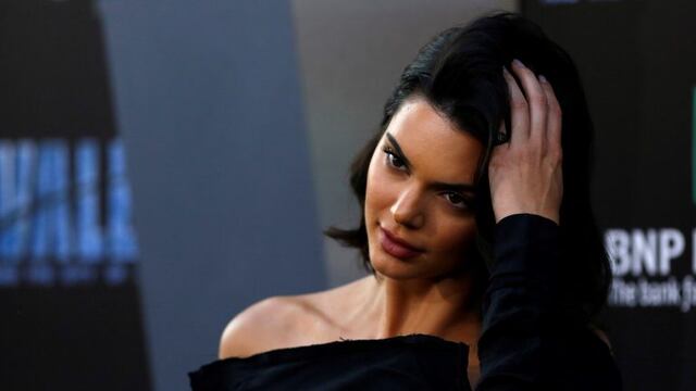 Model Kendall Jenner poses at the premiere of \