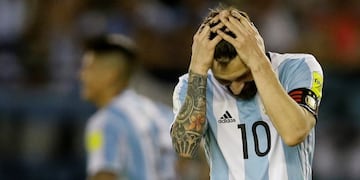 Argentinau2019s Lionel Messi reacts after missing a chance to score during a 2018 Russia World Cup qualifying soccer match between Argentina and Chile at the Monumental stadium in Buenos Aires, Argentina, Thursday March 23, 2017. At left is Argentinau2019s Lionel