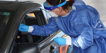 MILWAUKEE, WISCONSIN - OCTOBER 09: Members of the Wisconsin National Guard test residents for the coronavirus COVID-19 at a temporary test facility set up in the parking lot of the UMOS corporate headquarters on October 09, 2020 in Milwaukee, Wisconsin\u002E Wisconsin currently has one of the highest positivity rates for COVID-19 in the nation\u002E Scott Olson/Getty Images/AFP\n== FOR NEWSPAPERS, INTERNET, TELCOS & TELEVISION USE ONLY ==