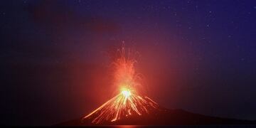 the anak krakatau (child of krakatau) volcano sends up powerful clouds of hot gasses rocks, and lava as a fishing boat is moored offshore early thursday nov\u002E 8, 2007, in the sunda straits between java and sumatra, indonesia\u002E  sending a boom echoing across the bay, the volcano known as the \