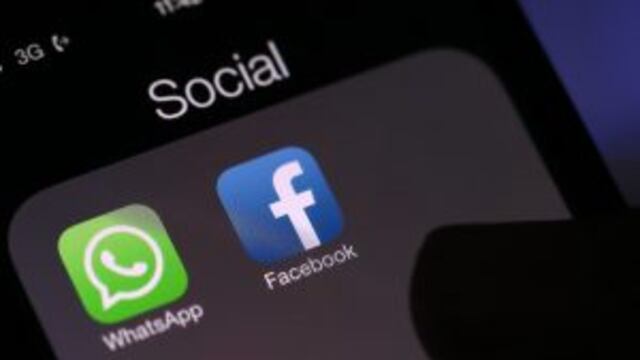 Icons for the WhatsApp Inc. mobile-messaging application WhatsApp and the Facebook Inc. application are displayed in a social media folder on the screen of an Apple Inc. iPhone in this arranged photograph taken in London, U.K., on Thursday, Feb. 20, 2014.