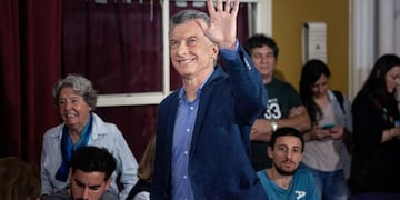 Mauricio Macri, Argentina's president, center, waves while arriving at a polling station during presidential elections in the Palermo neighborhood of Buenos Aires, Argentina, on Sunday, Oct\u002E 27, 2019\u002E Argentines are voting for their next president today against the backdrop of an economic and currency crisis, with concern over the cost of living and access to social services\u002E Photographer: Erica Canepa/Bloomberg