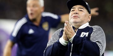 (FILES) In this file photo taken on March 07, 2020 Argentine former football star Diego Maradona acknowledges spectators during an homage before the start of the Argentina First Division 2020 Superliga Tournament football match Boca Juniors vs Gimnasia La Plata, at La Bombonera stadium, in Buenos Aires\u002E - Argentine football great Diego Maradona was admitted to hospital on November 2, 2020 for medical checks, his personal doctor announced\u002E (Photo by ALEJANDRO PAGNI / AFP)
