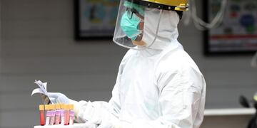 A health worker carries blood samples during a rapid test for the new coronavirus at a hospital in Jakarta, Indonesia, Tuesday, April 28, 2020\u002E The new coronavirus causes mild or moderate symptoms for most people, but for some, especially older adults and people with existing health problems, it can cause more severe illness or death\u002E (AP Photo/Achmad Ibrahim)