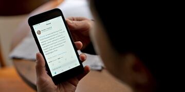A Twitter election interference tweet by U\u002ES\u002E President Donald Trump is displayed on a smartphone in an arranged photograph taken in Arlington, Virginia, U\u002ES\u002E, on Wednesday, May 26, 2020\u002E President Donald Trump threatened to regulate or shutter social media companies -- a warning apparently aimed at Twitter Inc\u002E after it began fact-checking his tweets\u002E Photographer: Andrew Harrer/Bloomberg