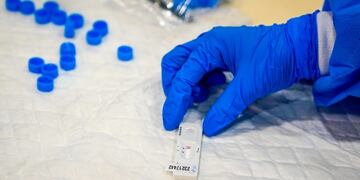 A healthcare worker performs a coronavirus disease COVID-19 rapid antigen test at a temporary testing site set up in the Puente de Vallecas district in Madrid, Spain, on Tuesday, Sept\u002E 29, 2020\u002E Spain's Health Minister Salvador Illa called on Madrid's regional government to take tougher steps to rein in Covid-19 cases as a dispute over how to control the pandemic deepens\u002E Photographer: Paul Hanna/Bloomberg